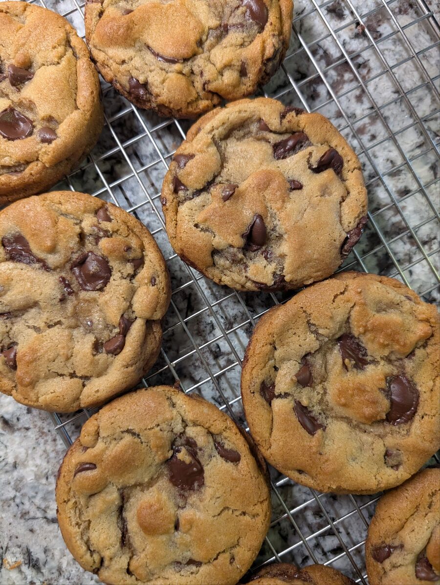 Chocolate chip cookies cooling on a wire rack